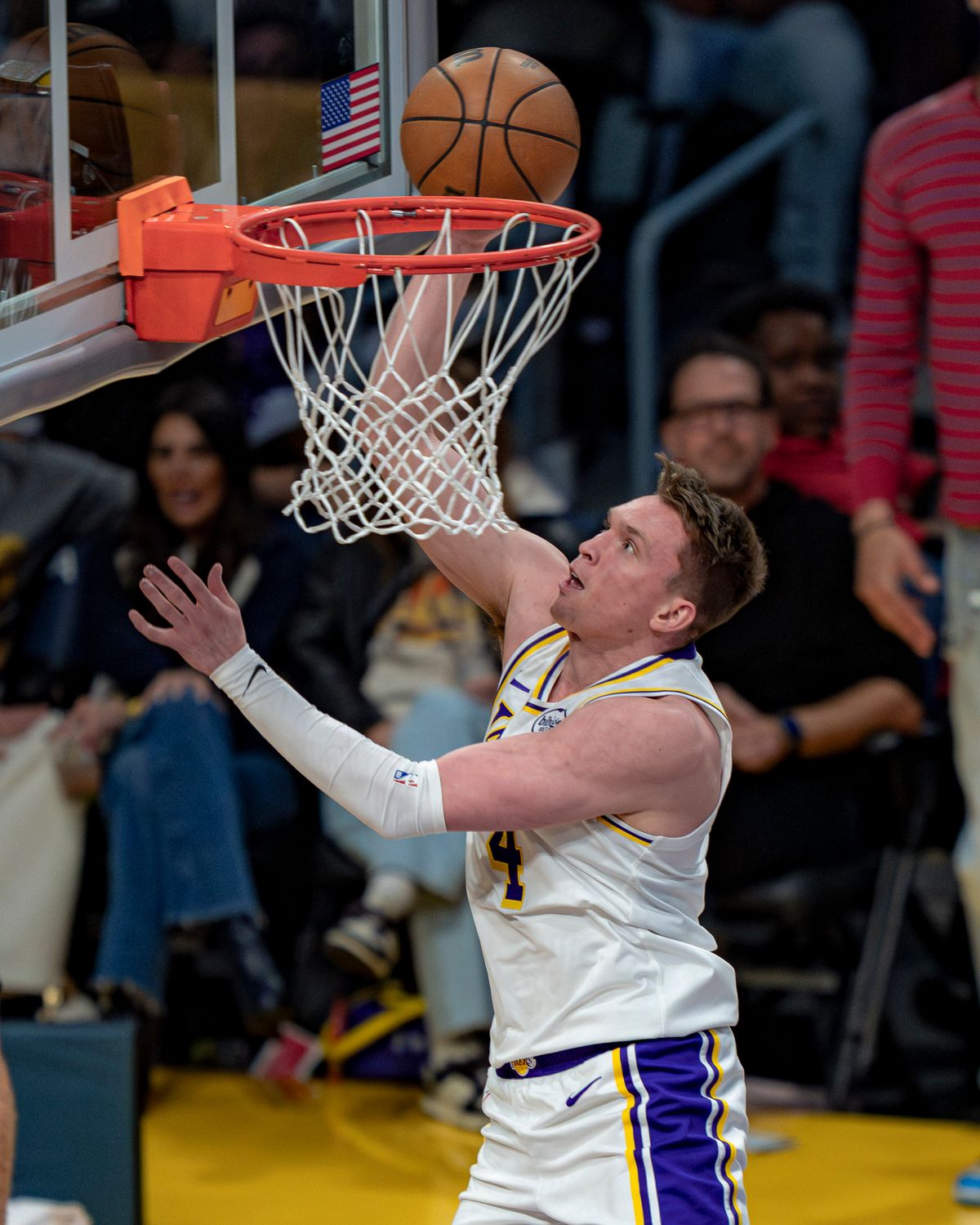 Los Angeles Lakers guard Dalton Knecht (4) dunking during an NBA basketball game against the Utah Jazz on April 12th, 2026 in Los Angeles, CA.