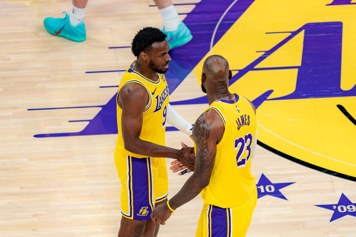 Los Angeles Lakers guard Bronny James Jr. (9) talking with his father, LeBron James, during an NBA basketball game against the Houston Rockets on April 18th, 2026 in Los Angeles, CA.