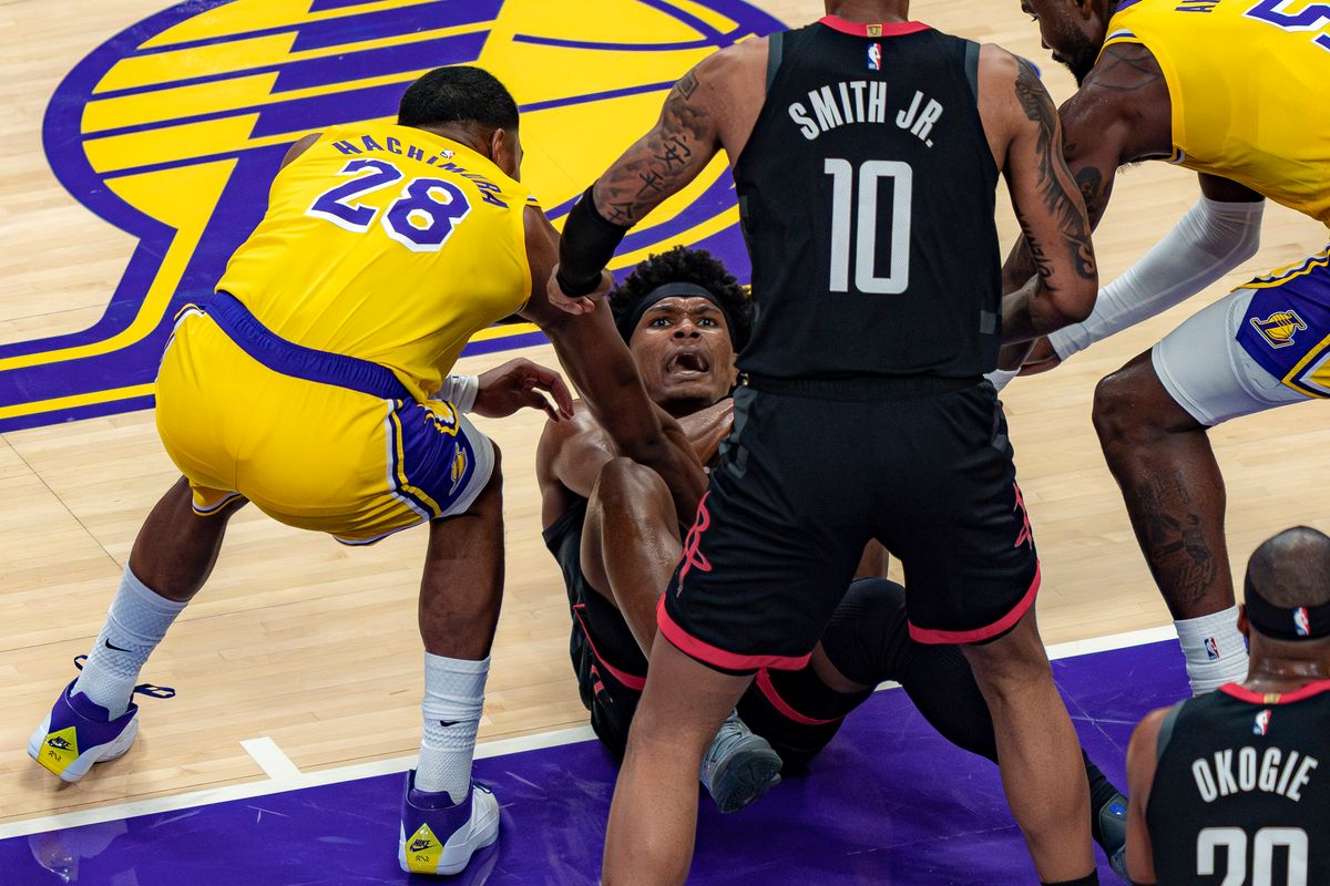 Los Angeles Lakers forward Rui Hachimura (28) helping a Rockets player to his feet during an NBA basketball game against the Houston Rockets on April 18th, 2026 in Los Angeles, CA.