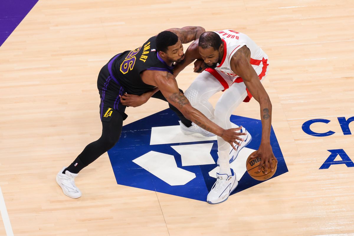 Kevin Durant #7 of the Houston Rockets handles the ball against Marcus Smart #36 of the Los Angeles Lakers during an NBA Playoffs basketball game, Tuesday April 21, 2026 in Los Angeles, Calif.