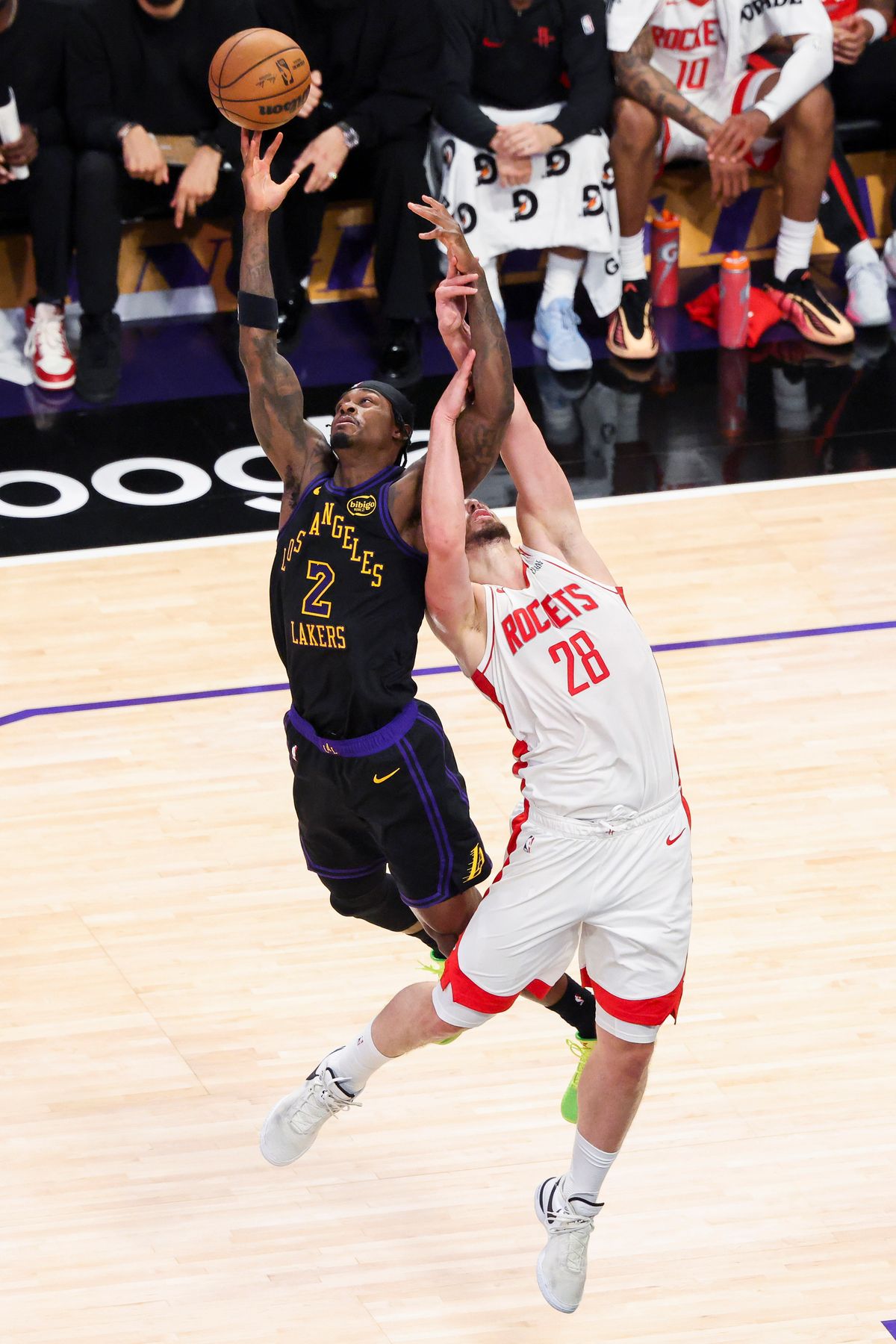 Jarred Vanderbilt #2 of the Los Angeles Lakers and Alperen Sengun #28 of the Houston Rockets battle for a loose ball during an NBA Playoffs basketball game, Tuesday April 21, 2026 in Los Angeles, Calif.