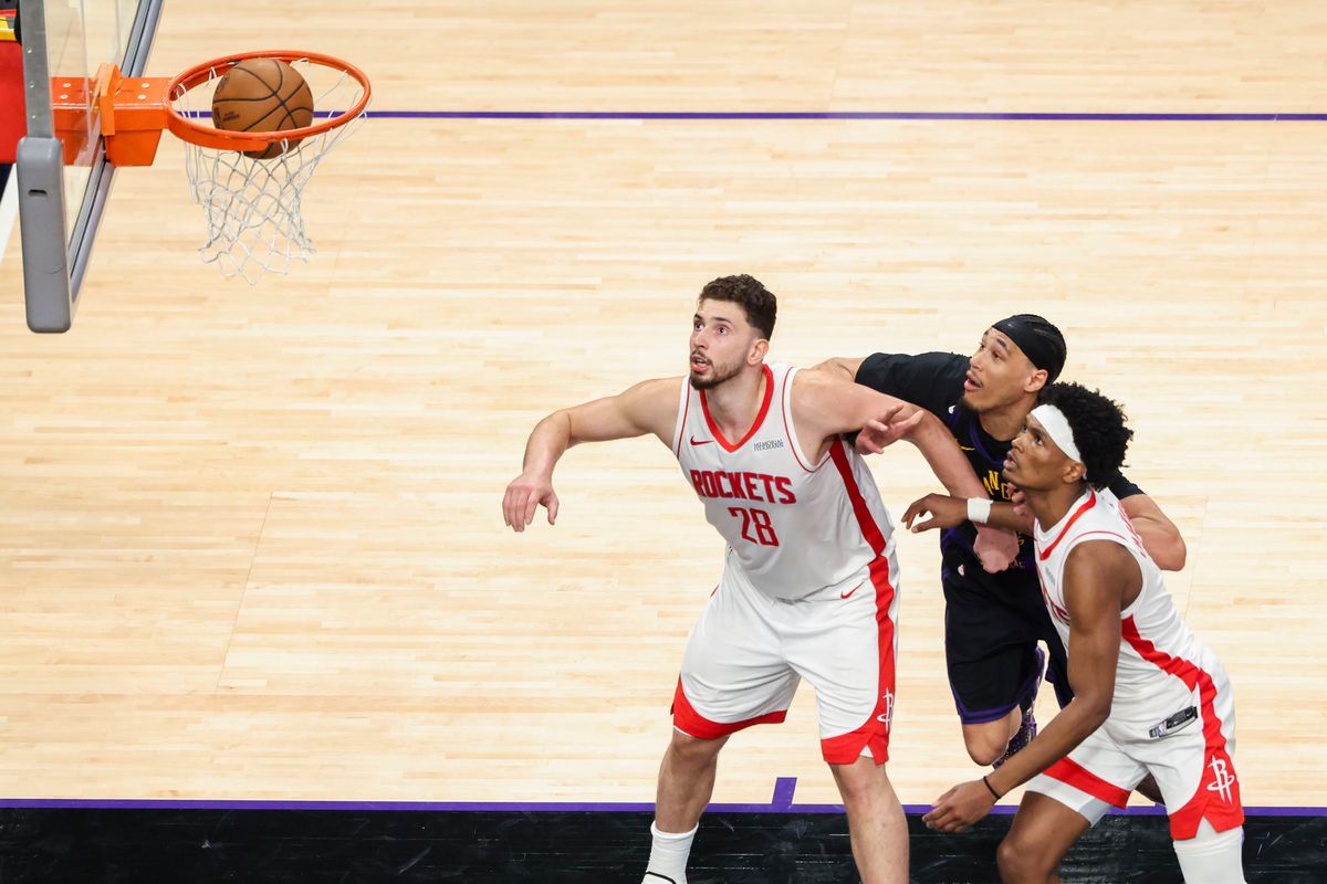 Alperen Sengun #28 and Amen Thompson #1 of the Houston Rockets box out Jaxson Hayes #11 of the Los Angeles Lakers as the ball goes through the net during an NBA Playoffs basketball game, Tuesday April 21, 2026 in Los Angeles, Calif.