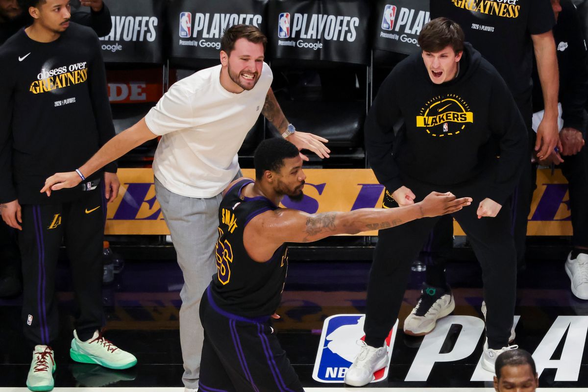 Luka Doncic #77 and Austin Reaves #15 of the Los Angeles Lakers celebrate a three point shot by Marcus Smart #36 of the Los Angeles Lakers during an NBA Playoffs basketball game against the Houston Rockets, Tuesday April 21, 2026 in Los Angeles, Calif.
