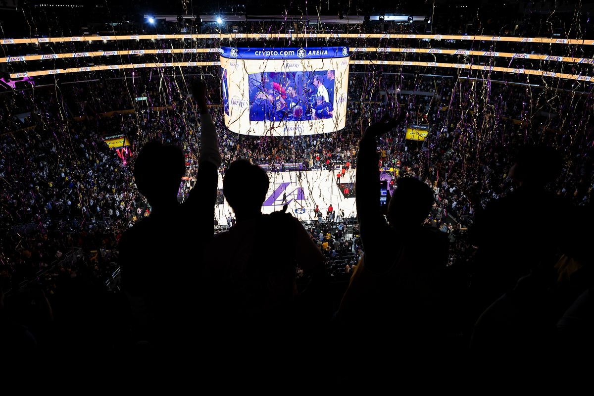 Los Angeles Lakers fans celebrate after their team wins an NBA Playoffs basketball game over the Houston Rockets, Tuesday April 21, 2026 in Los Angeles, Calif.