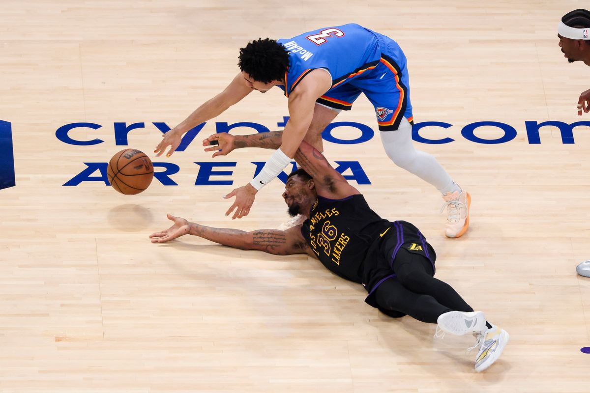 Marcus Smart #36 of the Los Angeles Lakers and Jared McCain #3 of the Oklahoma City Thunder fight for a loose ball during an NBA Playoffs basketball game, Monday May 11, 2026 in Los Angeles, Calif.