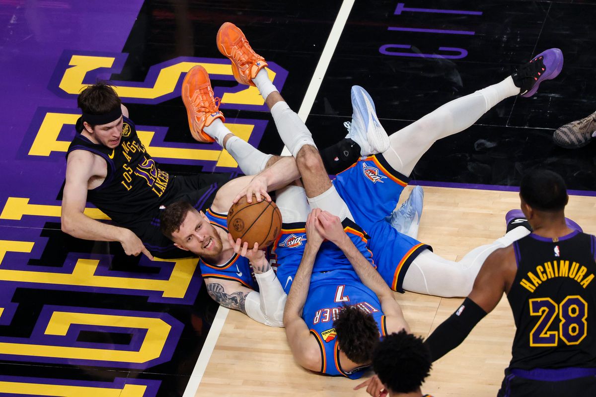 Isaiah Hartenstein #55 of the Oklahoma City Thunder grabs a loose ball as Austin Reaves #15 of the Los Angeles Lakers points to the baseline to signal he is out of bounds during an NBA Playoffs basketball game, Monday May 11, 2026 in Los Angeles, Calif.