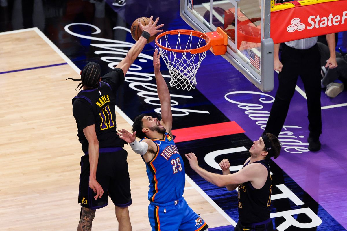 Jaxson Hayes #11 of the Los Angeles Lakers blocks the layup by Ajay Mitchell #25 of the Oklahoma City Thunder during an NBA Playoffs basketball game, Monday May 11, 2026 in Los Angeles, Calif.