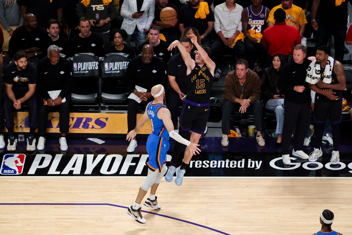 Austin Reaves #15 of the Los Angeles Lakers shoots a three pointer over Alex Caruso #9 of the Oklahoma City Thunder during an NBA Playoffs basketball game, Monday May 11, 2026 in Los Angeles, Calif.