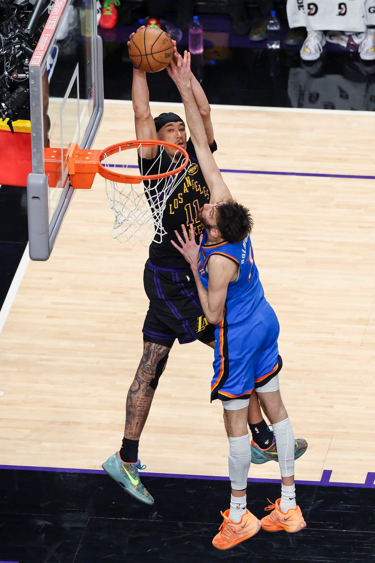 Jaxson Hayes #11 of the Los Angeles Lakers dunks the ball over Chet Holmgren #7 of the Oklahoma City Thunder during an NBA Playoffs basketball game, Monday May 11, 2026 in Los Angeles, Calif.