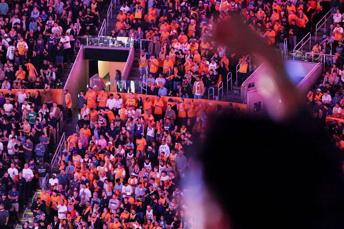 Los Angeles Lakers fans celebrate during the fourth quarter of an NBA Playoffs basketball game against the Oklahoma City Thunder, Monday May 11, 2026 in Los Angeles, Calif.