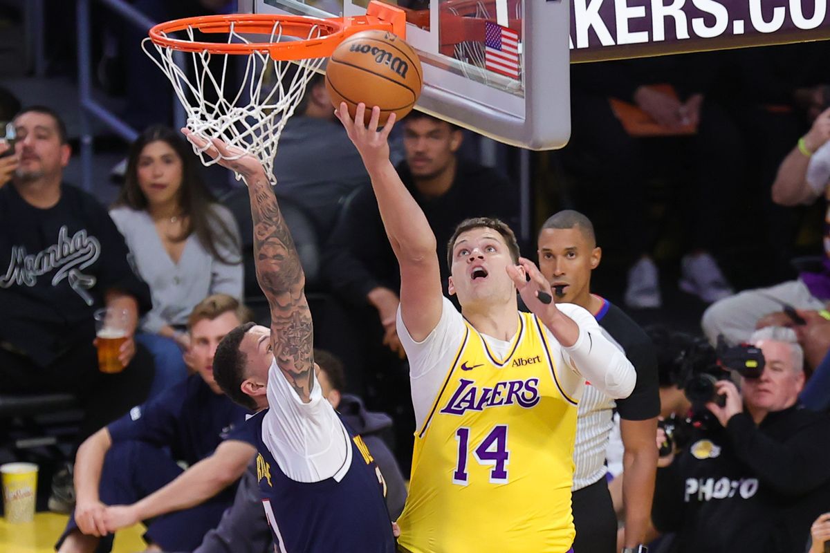 Los Angeles Lakers C Walker Kessler (14) shoots a lay up during an NBA basketball game against the Denver Nuggets, Friday October 16, 2026 in Los Angeles, Calif.