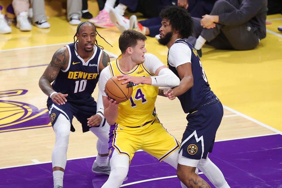 Los Angeles Lakers C Walker Kessler (14) battles in the post during an NBA basketball game against the Denver Nuggets, Friday October 16, 2026 in Los Angeles, Calif.