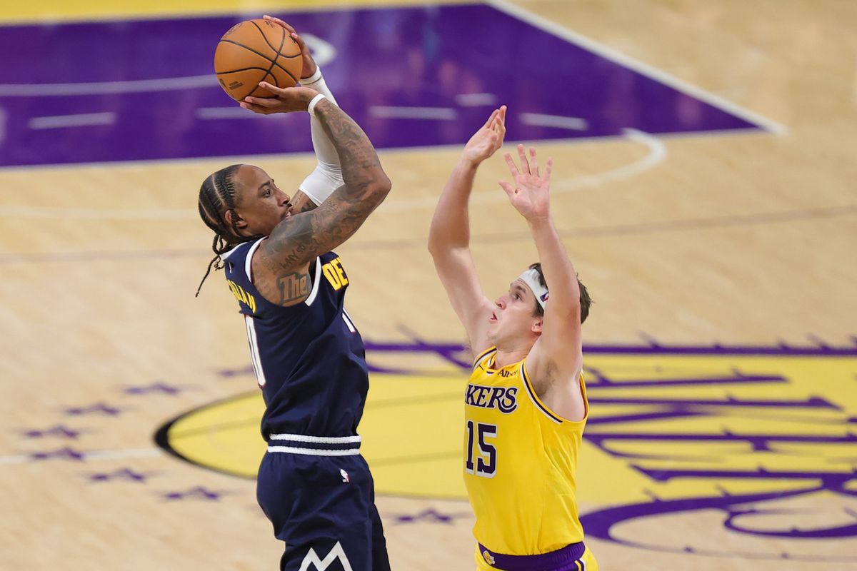 Los Angeles Lakers G Austin Reaves (15) defends against Denver Nuggets G Demar Derozan (10) during an NBA basketball game, Friday October 16, 2026 in Los Angeles, Calif.