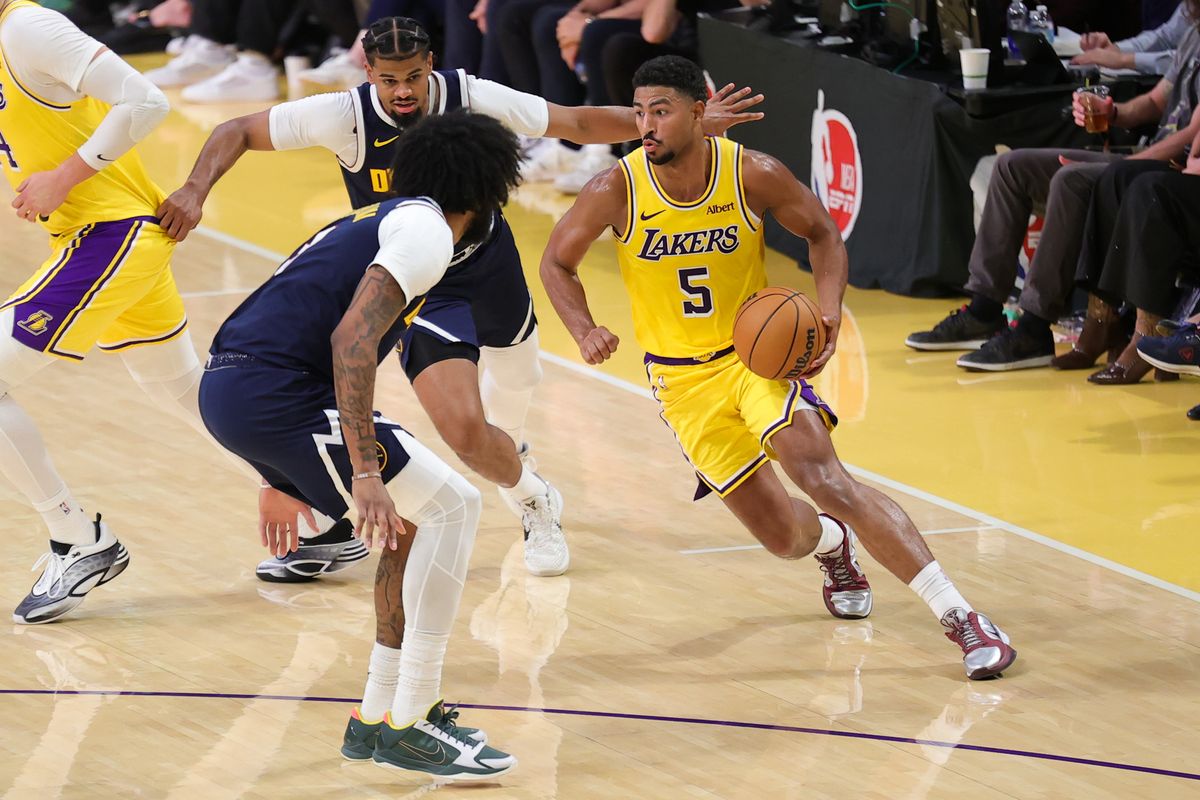 Los Angeles Lakers G Quentin Grimes (5) dribbles the basketball during an NBA basketball game against the Denver Nuggets, Friday October 16, 2026 in Los Angeles, Calif.