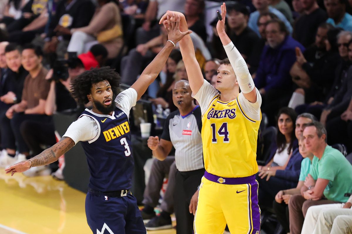 Los Angeles Lakers C Walker Kessler (14) shoots a jumpshot during an NBA basketball game against the Denver Nuggets, Friday October 16, 2026 in Los Angeles, Calif.