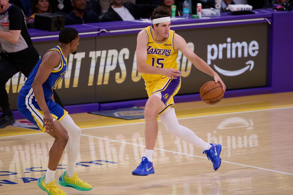 The Los Angeles Lakers guard Austin Reaves (15) controls the ball during an NBA basketball game against The Golden State Warriors on October 21st, 2026 at crypto Arena in Los Angeles, California The Los Angeles Lakers guard Austin Reaves (15) controls the ball during an NBA basketball game against The Golden State Warriors on October 21st, 2026 at crypto Arena in Los Angeles, California