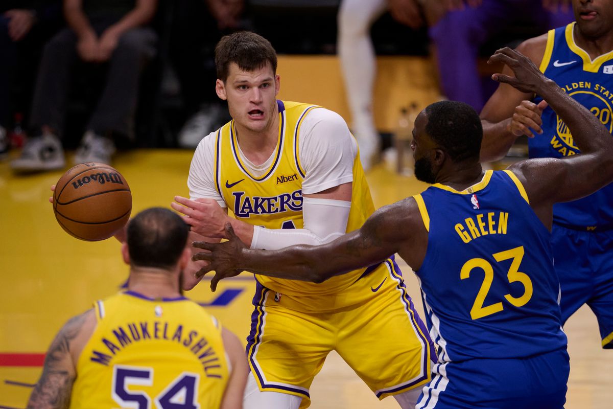 The Los Angeles Lakers center Walker Kessler (14) passes the ball during an NBA basketball game against The Golden State Warriors on October 21st, 2026 at crypto Arena in Los Angeles, California The Los Angeles Lakers center Walker Kessler (14) passes the ball during an NBA basketball game against The Golden State Warriors on October 21st, 2026 at crypto Arena in Los Angeles, California