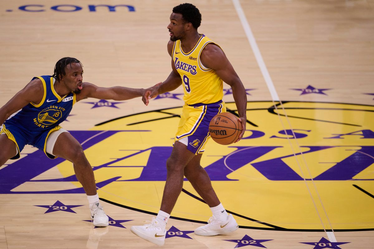 The Los Angeles Lakers guard Bronny James (9) controls the ball during an NBA basketball game against The Golden State Warriors on October 21st, 2026 at crypto Arena in Los Angeles, California The Los Angeles Lakers guard Bronny James (9) controls the ball during an NBA basketball game against The Golden State Warriors on October 21st, 2026 at crypto Arena in Los Angeles, California