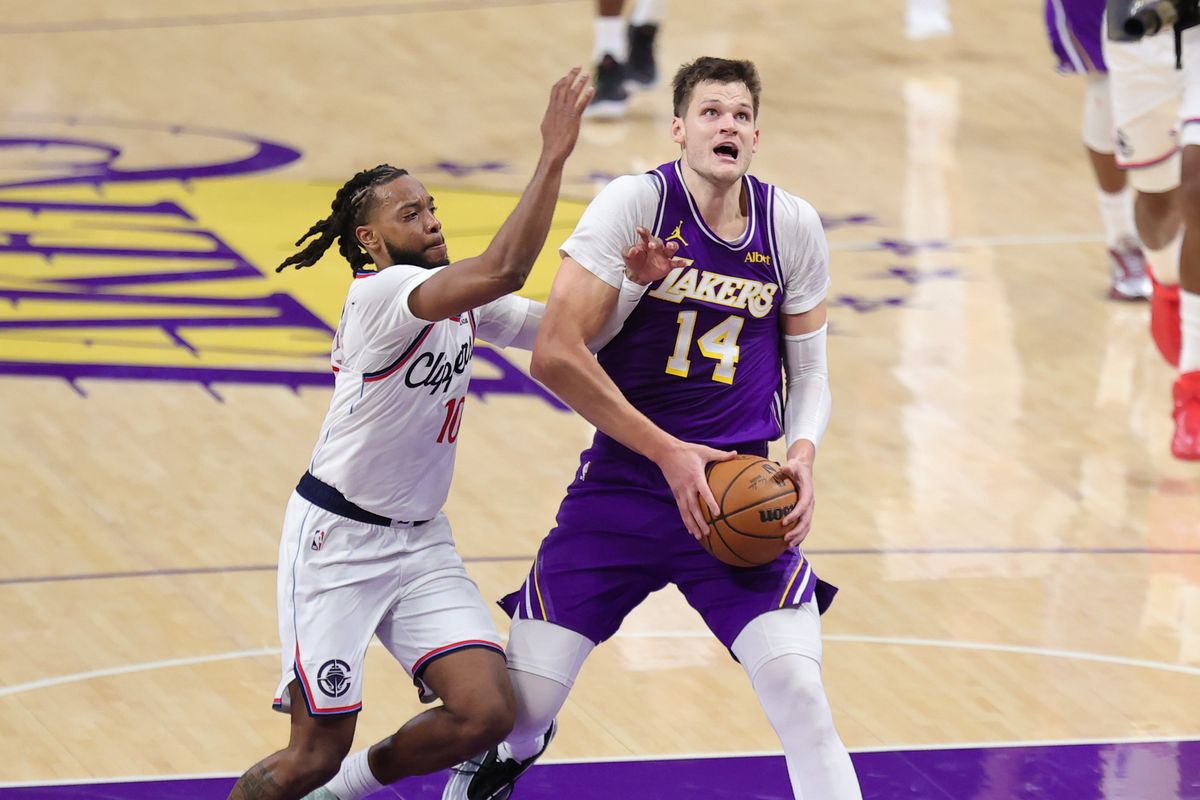 Los Angeles Lakers C Walker Kesler (14) drives the lane against Los Angeles Clippers G Darius Garland (10) during an NBA basketball game, Friday October 23, 2026 in Los Angeles, Calif. Los Angeles Lakers C Walker Kesler (14) drives the lane against Los Angeles Clippers G Darius Garland (10) during an NBA basketball game, Friday October 23, 2026 in Los Angeles, Calif.