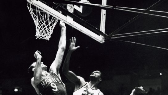  Los Angeles Lakers forward Tom Hawkins (20) scores over St. Louis Hawks forward Bob Pettit (9) in front of Jerry West (44) during game 6 of the 1961 Western Division championship at the Los Angeles Sports Arena. M