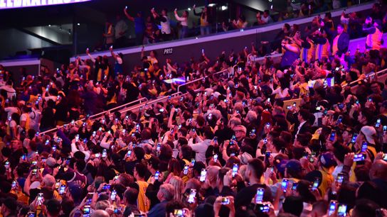 Mar 7, 2023; Los Angeles, California, USA; Fans record as the jersey of former Los Angeles Lakers player Pau Gasol is unveiled during halftime at Crypto.com Arena. 