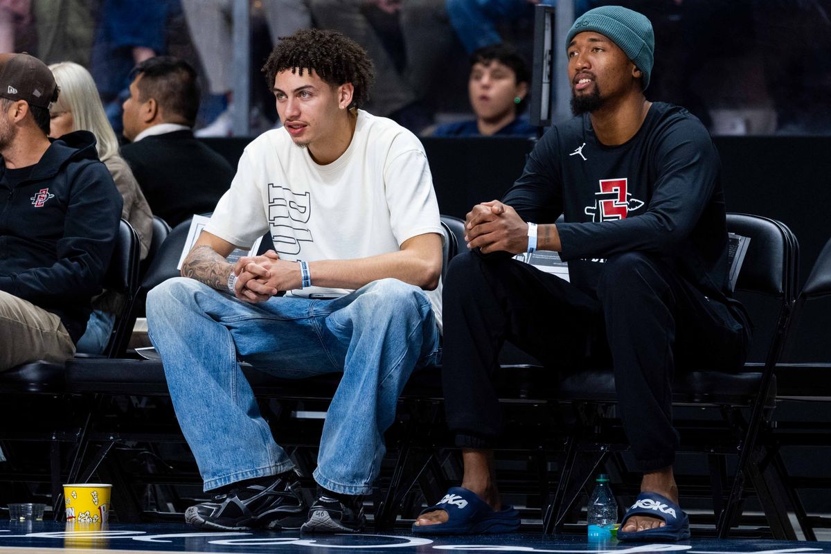 San Diego State players Miles Byrd (left) and Jeremiah Oden (right) watch a G League Basketball game between Sioux Falls and San Diego, Saturday December 27, 2025 at Frontwave Arena in Oceanside, Calif.