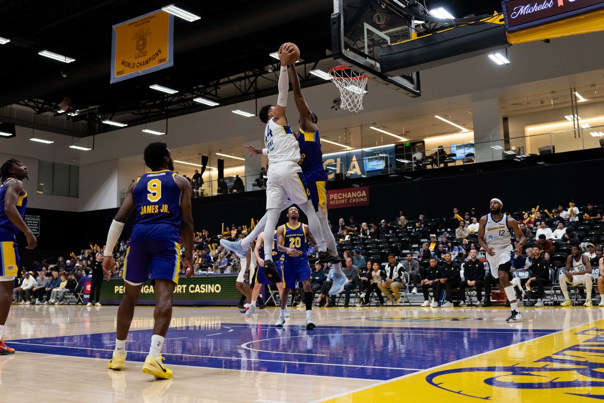 South Bay Lakers center Christian Koloko (10) blocks a shot during an NBA G League basketball game against the Santa Cruz Warriors on Friday, Nov. 21, 2025, in El Segundo, Calif.