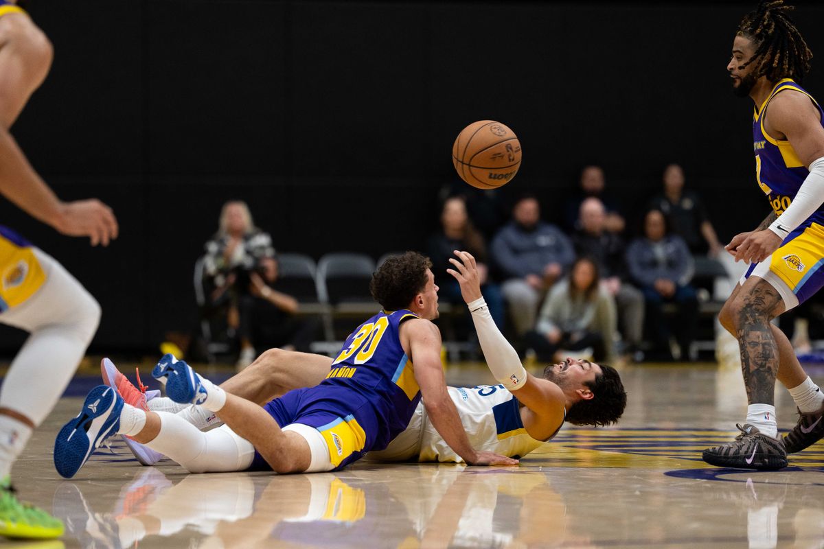 South Bay Lakers guard Chris Mañon (30) battles for a loose ball on the floor during an NBA G League basketball game against the Santa Cruz Warriors on Friday, Nov. 21, 2025, in El Segundo, Calif.