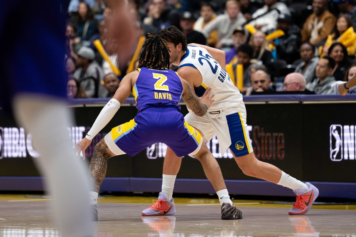 South Bay Lakers guard RJ Davis (2) defends a player during an NBA G League basketball game against the Santa Cruz Warriors on Friday, Nov. 21, 2025, in El Segundo, Calif.