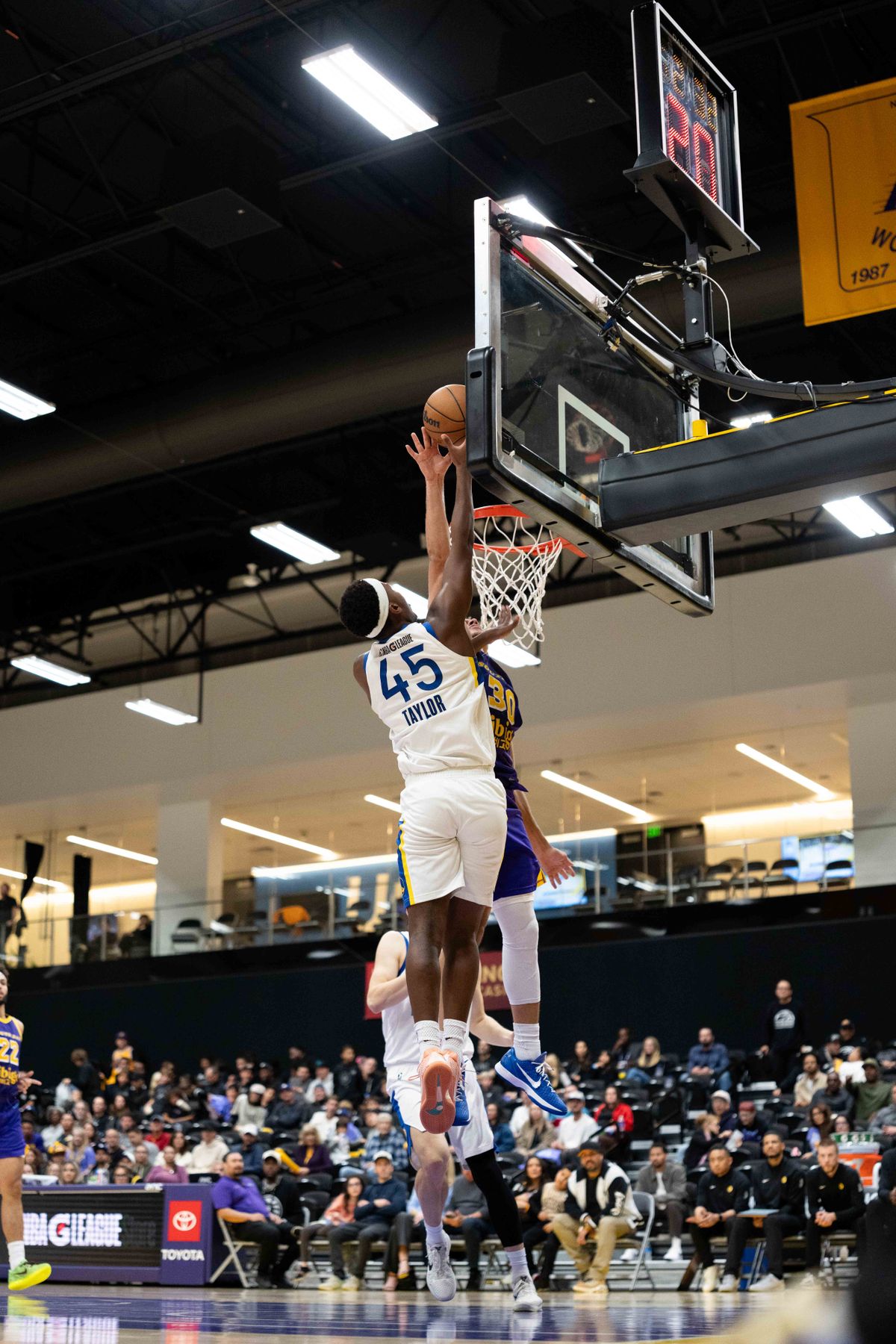 South Bay Lakers guard Chris Mañon (30) blocks a shot during an NBA G League basketball game against the Santa Cruz Warriors on Friday, Nov. 21, 2025, in El Segundo, Calif.