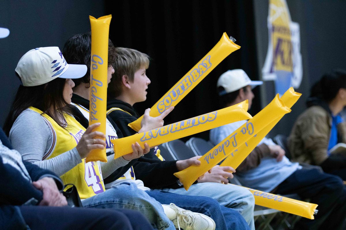 Fans cheer with thunder sticks during a G-League basketball game between the South Bay Lakers and Memphis Hustle Tuesday, January 6, 2026 at UCLA Health Training Center in El Segendo, Calif.