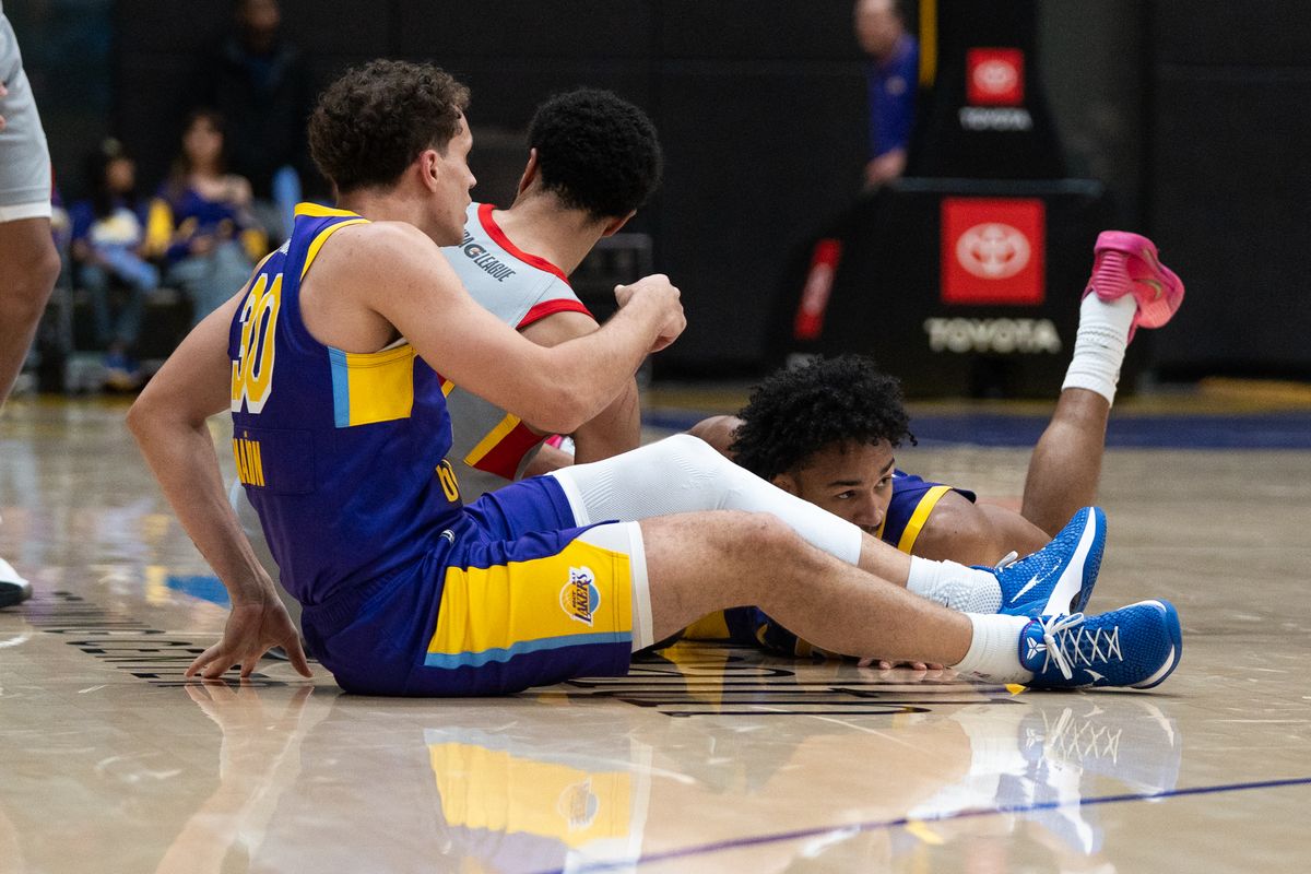 South Bay Lakers players dive on the floor for a loose ball during a G-League basketball game against College Park Skyhawks Tuesday, January 27, 2026 at UCLA Health Training Center in El Segundo, Calif.