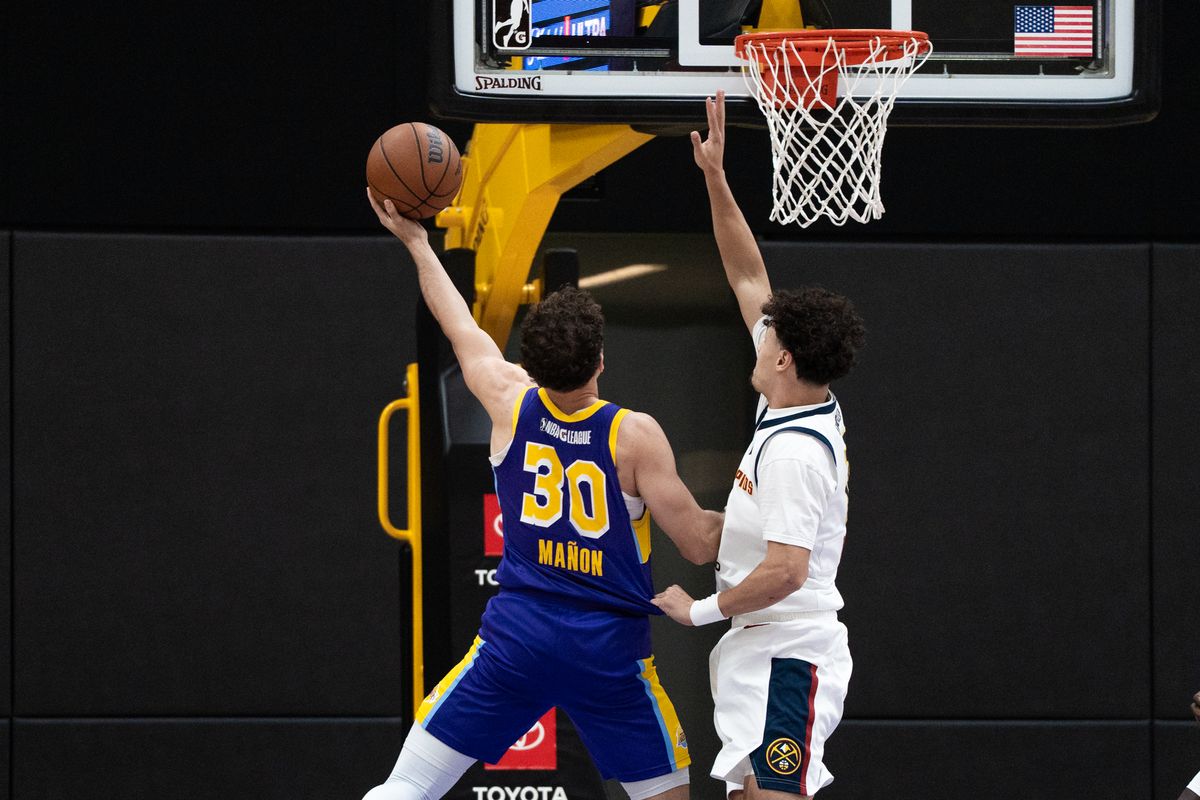 South Bay Lakers guard Chris Manon (30) goes up on his defender and finishes a tough layup during an NBA G-League basketball game against the Grand Rapids Gold, Saturday March 21st, 2026 in El Segundo California