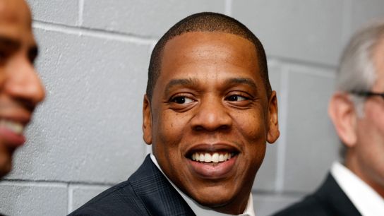 Jay-Z speaks with an acquaintance before a press conference to introduce new Seattle Mariners second baseman Robinson Cano (not pictured) at Safeco Field. Jay-Z speaks with an acquaintance before a press conference to introduce new Seattle Mariners second baseman Robinson Cano (not pictured) at Safeco Field.