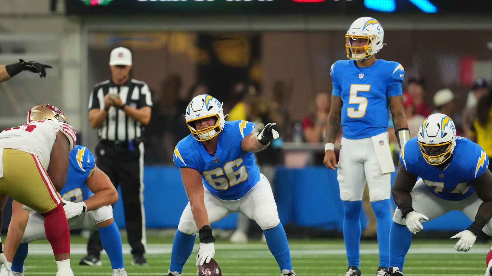 Aug 20, 2026; Inglewood, California, USA; Los Angeles Chargers center Jake Slaughter (66) prepares to snap the ball to quarterback Trey Lance (5) in the first half against the San Francisco 49ers at SoFi Stadium. Aug 20, 2026; Inglewood, California, USA; Los Angeles Chargers center Jake Slaughter (66) prepares to snap the ball to quarterback Trey Lance (5) in the first half against the San Francisco 49ers at SoFi Stadium.