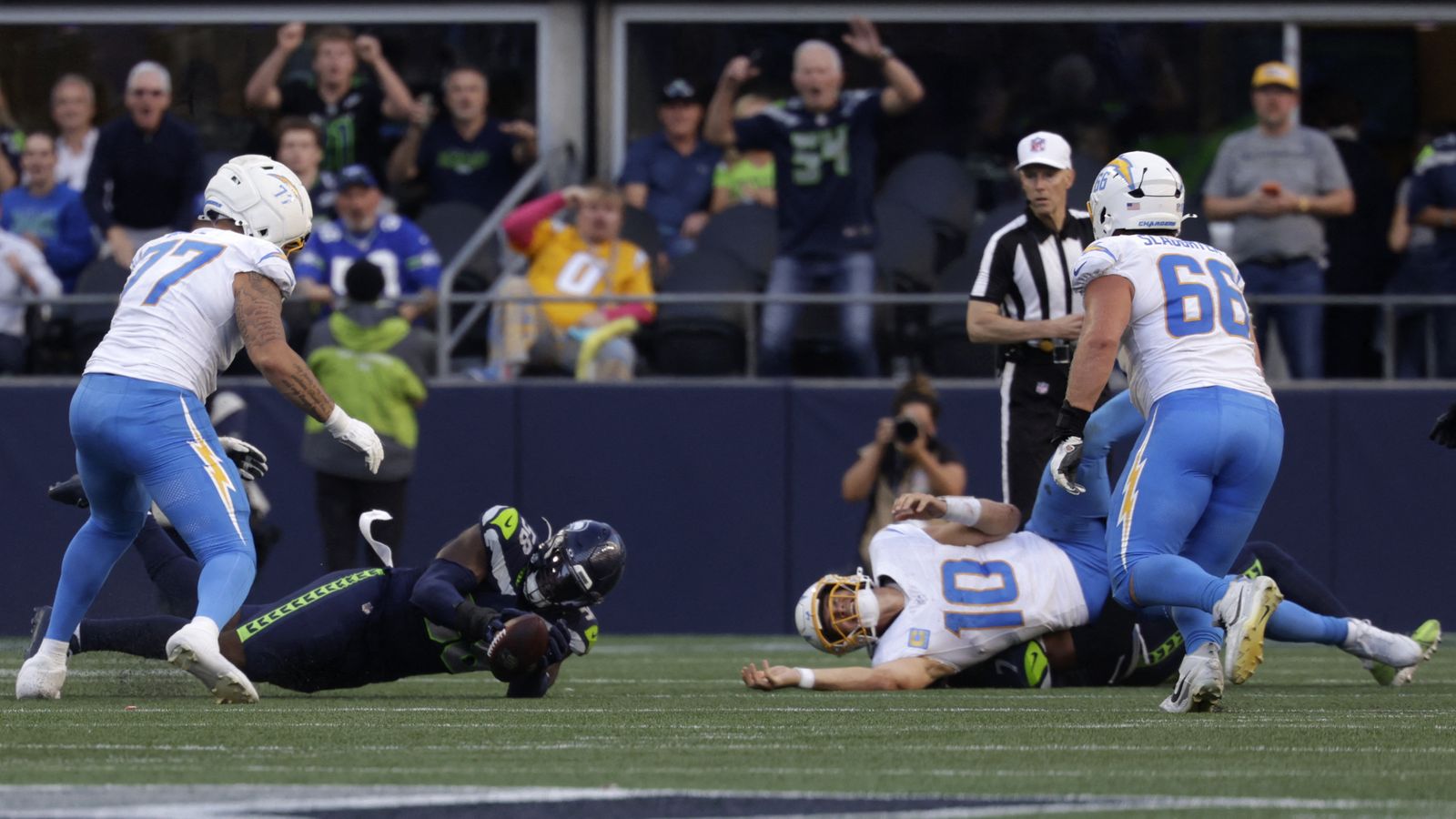 Oct 4, 2026; Seattle, Washington, USA; Seattle Seahawks linebacker Derick Hall (58) recovers a fumble from Los Angeles Chargers quarterback Justin Herbert (10) during the second half at Lumen Field. Oct 4, 2026; Seattle, Washington, USA; Seattle Seahawks linebacker Derick Hall (58) recovers a fumble from Los Angeles Chargers quarterback Justin Herbert (10) during the second half at Lumen Field.