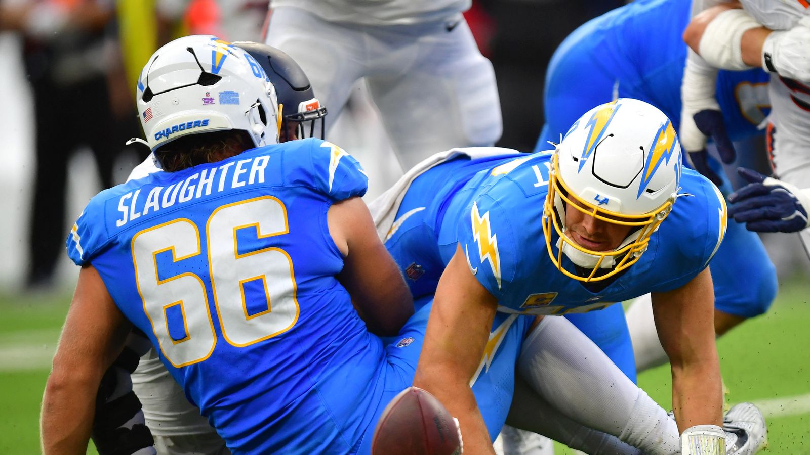 Oct 11, 2026; Inglewood, California, USA; Los Angeles Chargers quarterback Justin Herbert (10) looks to recover a fumble against the Denver Broncos during the second half at SoFi Stadium. Oct 11, 2026; Inglewood, California, USA; Los Angeles Chargers quarterback Justin Herbert (10) looks to recover a fumble against the Denver Broncos during the second half at SoFi Stadium.