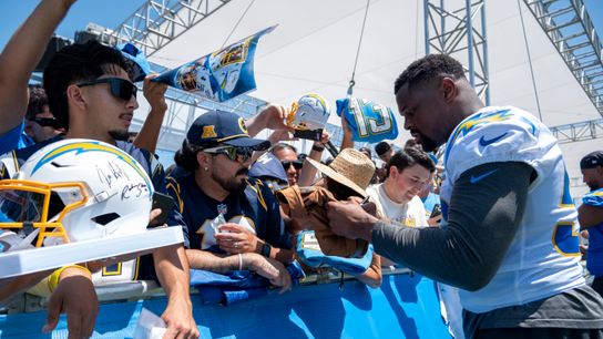 Los Angeles Chargers linebacker Khalil Mack (52) signing merchandise for fans during Chargers training camp at The Bolt on Monday, July 30th in El Segundo, CA.