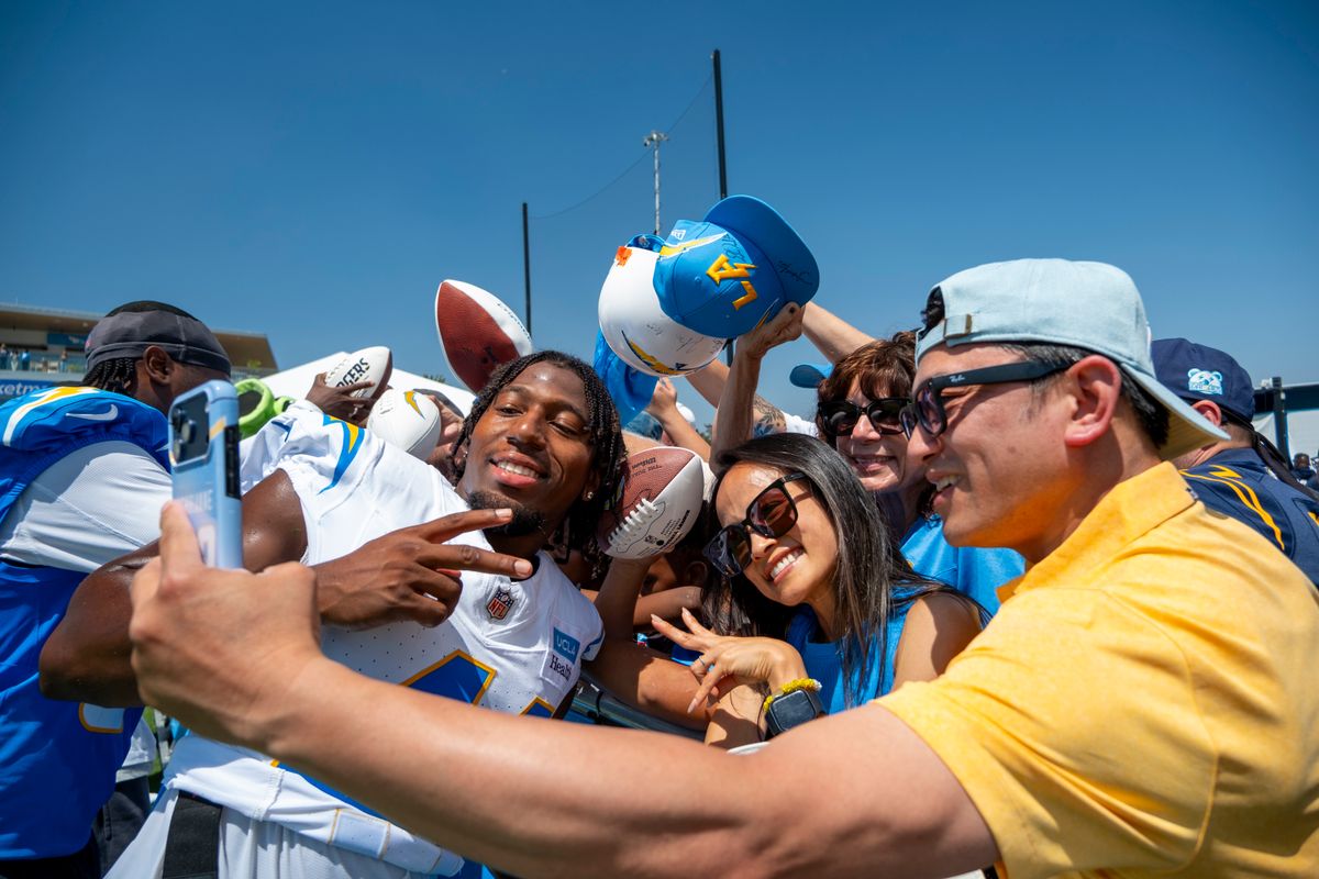 Los Angeles Chargers safety Myles Purchase (41) taking photos with fans during Chargers training camp at The Bolt on Friday, July 31st in El Segundo, CA. Los Angeles Chargers safety Myles Purchase (41) taking photos with fans during Chargers training camp at The Bolt on Friday, July 31st in El Segundo, CA.