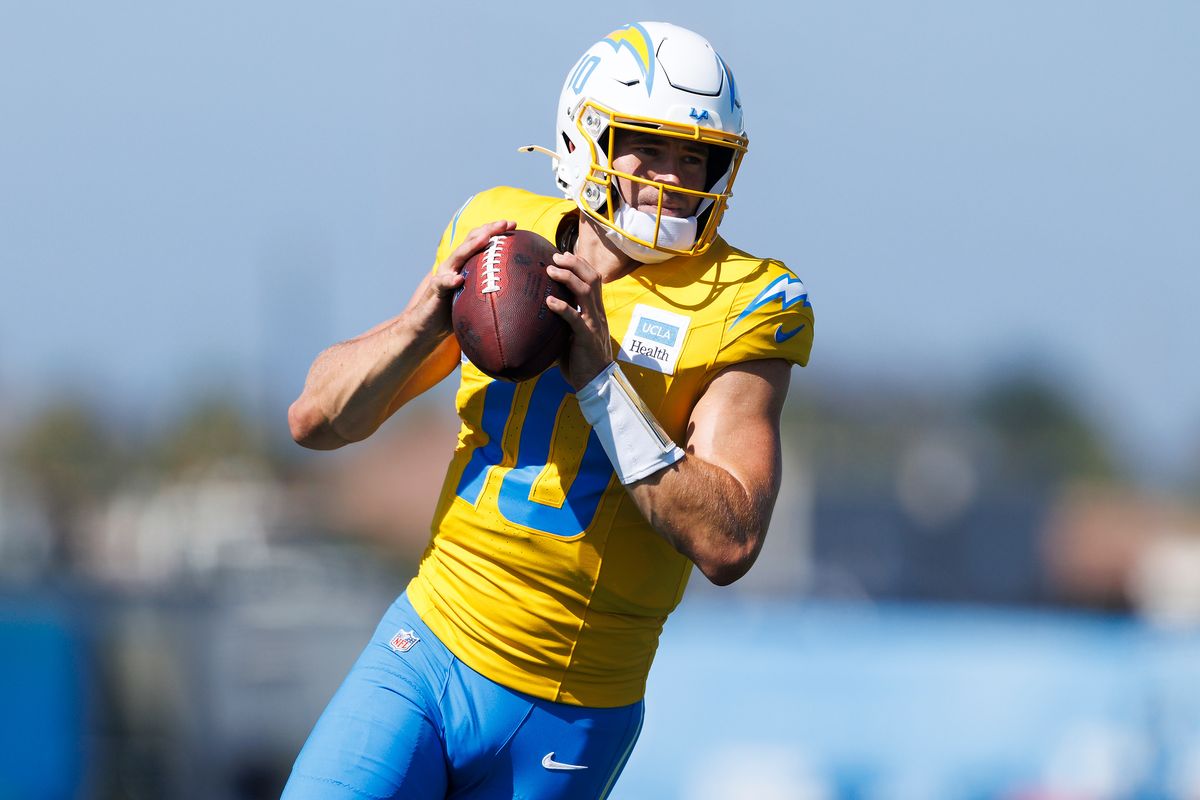 Justin Herbert #10 of the Los Angeles Chargers rolls out to pass during training camp at The Bolt on August 8, 2026 in El Segundo, California. Justin Herbert #10 of the Los Angeles Chargers rolls out to pass during training camp at The Bolt on August 8, 2026 in El Segundo, California.