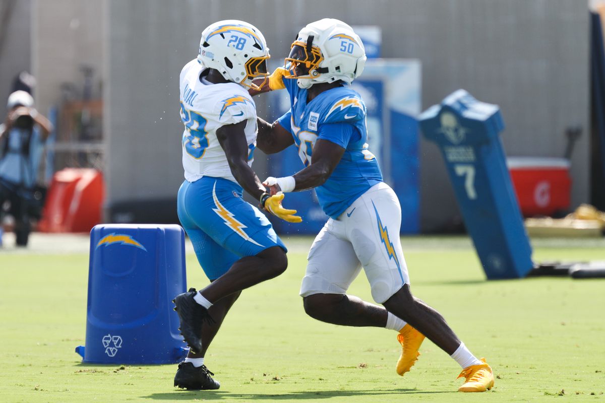 Kimani Vidal #28 and Emany Johnson #50 of the Los Angeles Chargers participate in drills during training camp at The Bolt on August 9, 2026 in El Segundo, California. Kimani Vidal #28 and Emany Johnson #50 of the Los Angeles Chargers participate in drills during training camp at The Bolt on August 9, 2026 in El Segundo, California.