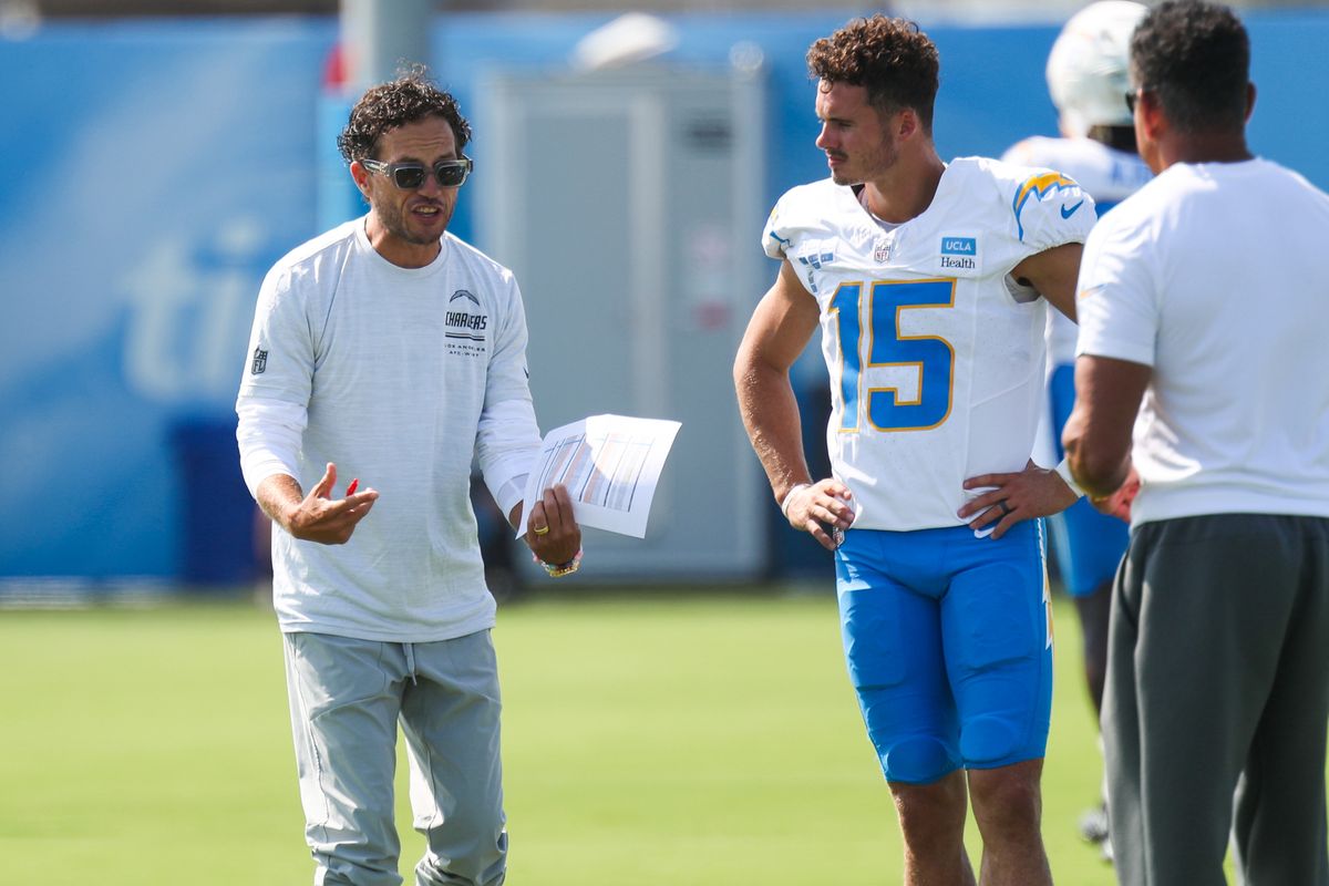 Offensive coordinator Mike McDaniel speaks with #15 Ladd McConkey of the Los Angeles Chargers during training camp at The Bolt on August 9, 2026 in El Segundo, California. Offensive coordinator Mike McDaniel speaks with #15 Ladd McConkey of the Los Angeles Chargers during training camp at The Bolt on August 9, 2026 in El Segundo, California.