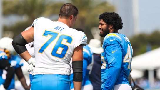 Joe Alt #76 and Tuli Tuipulou #45 of the Los Angeles Chargers speak to each other during training camp at The Bolt on August 11, 2026 in El Segundo, California.