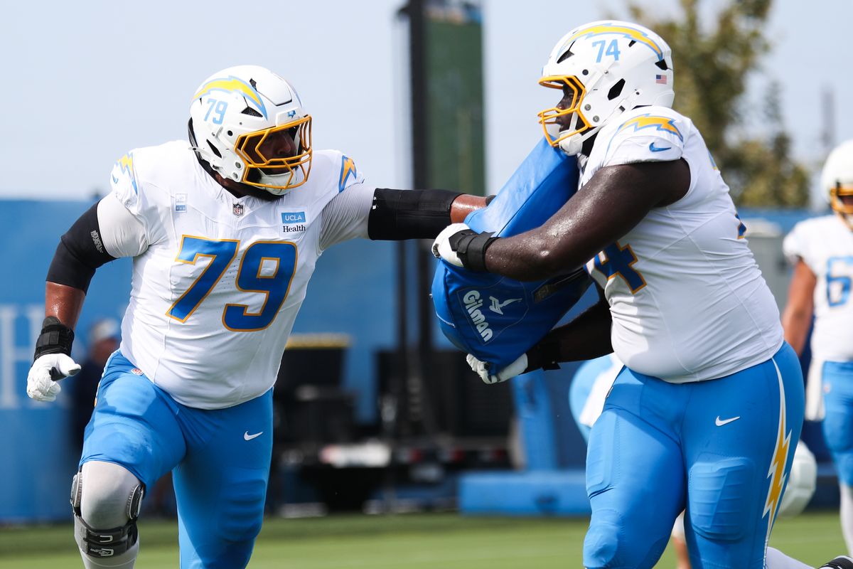 Trey Pipkins III #79 and Kayode Awosika #74 of the Los Angeles Chargers participate in drills during training camp at The Bolt on August 11, 2026 in El Segundo, California. Trey Pipkins III #79 and Kayode Awosika #74 of the Los Angeles Chargers participate in drills during training camp at The Bolt on August 11, 2026 in El Segundo, California.