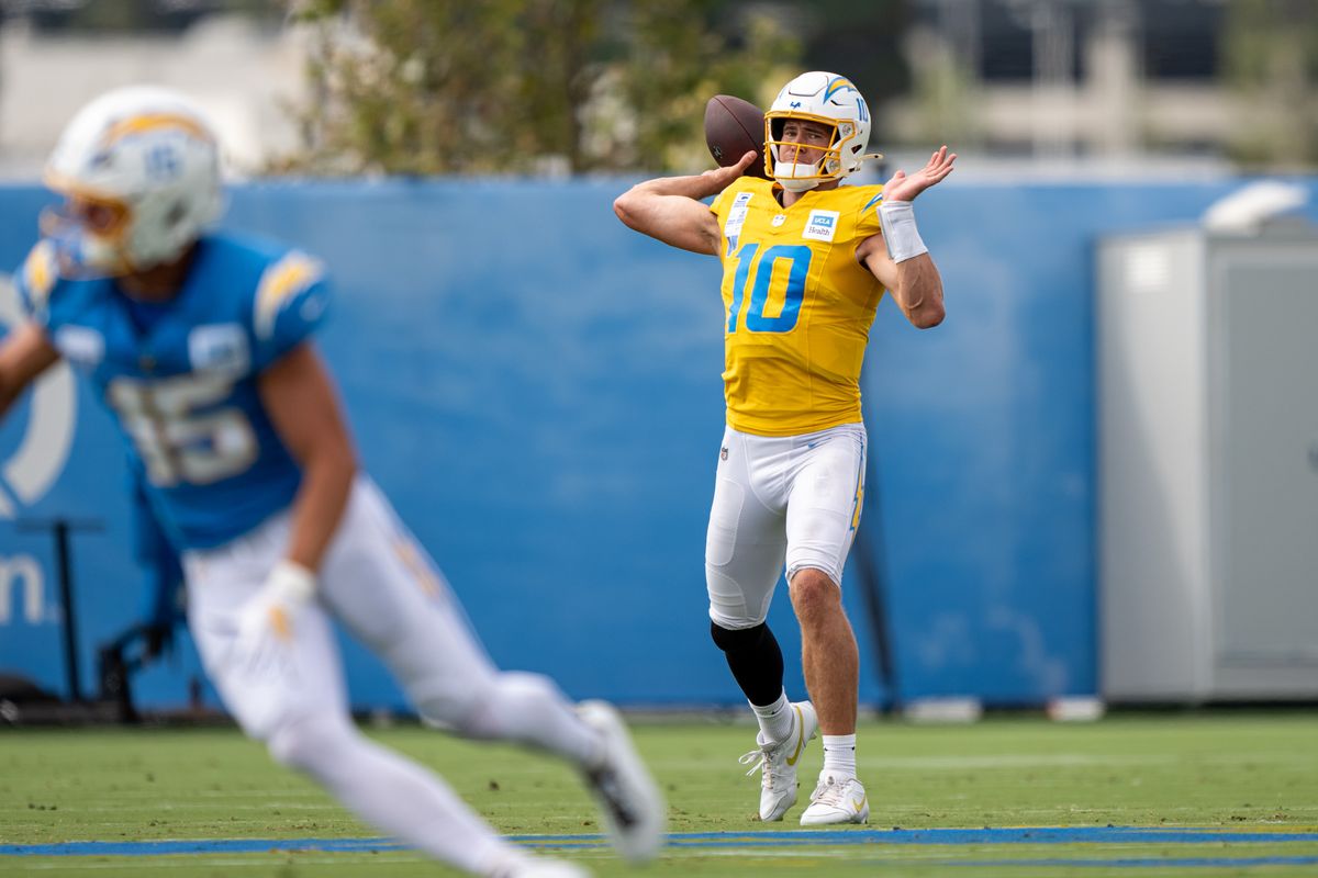 Los Angeles Chargers quarterback Justin Herbert (10) passing the ball to wide receiver Ladd McConkey (15) during Chargers training camp at The Bolt on Saturday, August 15th in El Segundo, CA. Los Angeles Chargers quarterback Justin Herbert (10) passing the ball to wide receiver Ladd McConkey (15) during Chargers training camp at The Bolt on Saturday, August 15th in El Segundo, CA.