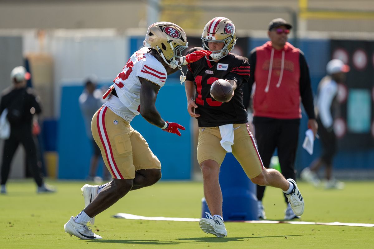 San Francisco 49ers quarterback Brock Purdy (13) handing the ball off to running back Patrick Taylor Jr. (32) during a joint Chargers and 49ers training camp at The Bolt on Saturday, August 18th in El Segundo, CA. San Francisco 49ers quarterback Brock Purdy (13) handing the ball off to running back Patrick Taylor Jr. (32) during a joint Chargers and 49ers training camp at The Bolt on Saturday, August 18th in El Segundo, CA.