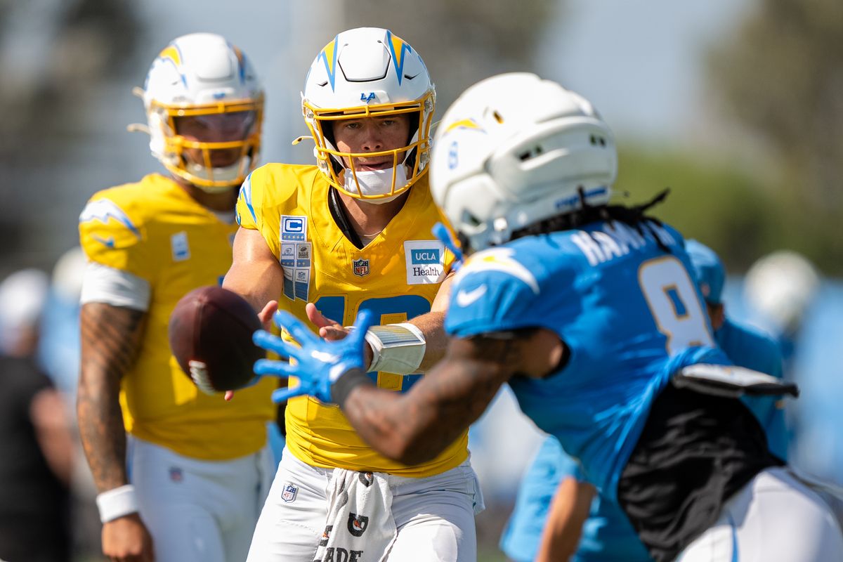 Los Angeles Chargers quarterback Justin Herbert (10) tossing the ball to running back Omarion Hampton (8) during a joint Chargers and 49ers training camp at The Bolt on Saturday, August 18th in El Segundo, CA. Los Angeles Chargers quarterback Justin Herbert (10) tossing the ball to running back Omarion Hampton (8) during a joint Chargers and 49ers training camp at The Bolt on Saturday, August 18th in El Segundo, CA.