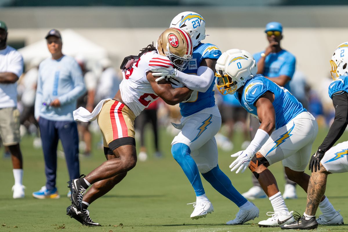 San Francisco 49ers running back Kaelon Black (26) trucking Chargers safety Tony Jefferson (23) during a joint Chargers and 49ers training camp at The Bolt on Saturday, August 18th in El Segundo, CA. San Francisco 49ers running back Kaelon Black (26) trucking Chargers safety Tony Jefferson (23) during a joint Chargers and 49ers training camp at The Bolt on Saturday, August 18th in El Segundo, CA.