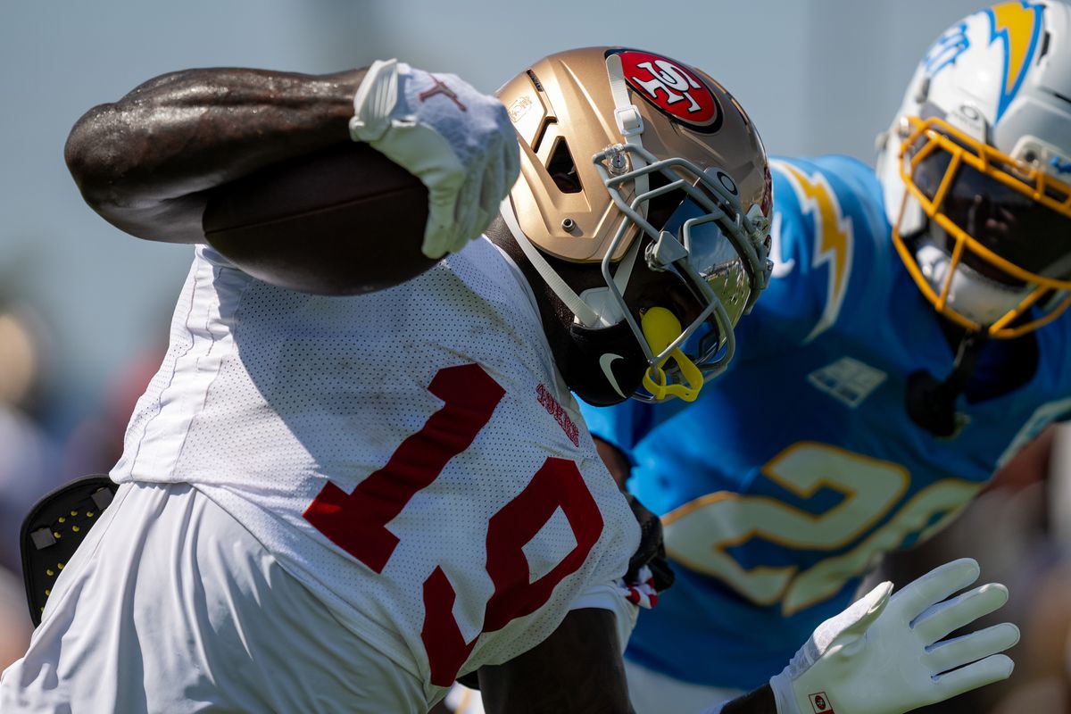 San Francisco 49ers wide receiver Deebo Samuel Sr. (19) trying to evade Chargers corner back Cam Hart (20) during a joint Chargers and 49ers training camp at The Bolt on Saturday, August 18th in El Segundo, CA. San Francisco 49ers wide receiver Deebo Samuel Sr. (19) trying to evade Chargers corner back Cam Hart (20) during a joint Chargers and 49ers training camp at The Bolt on Saturday, August 18th in El Segundo, CA.