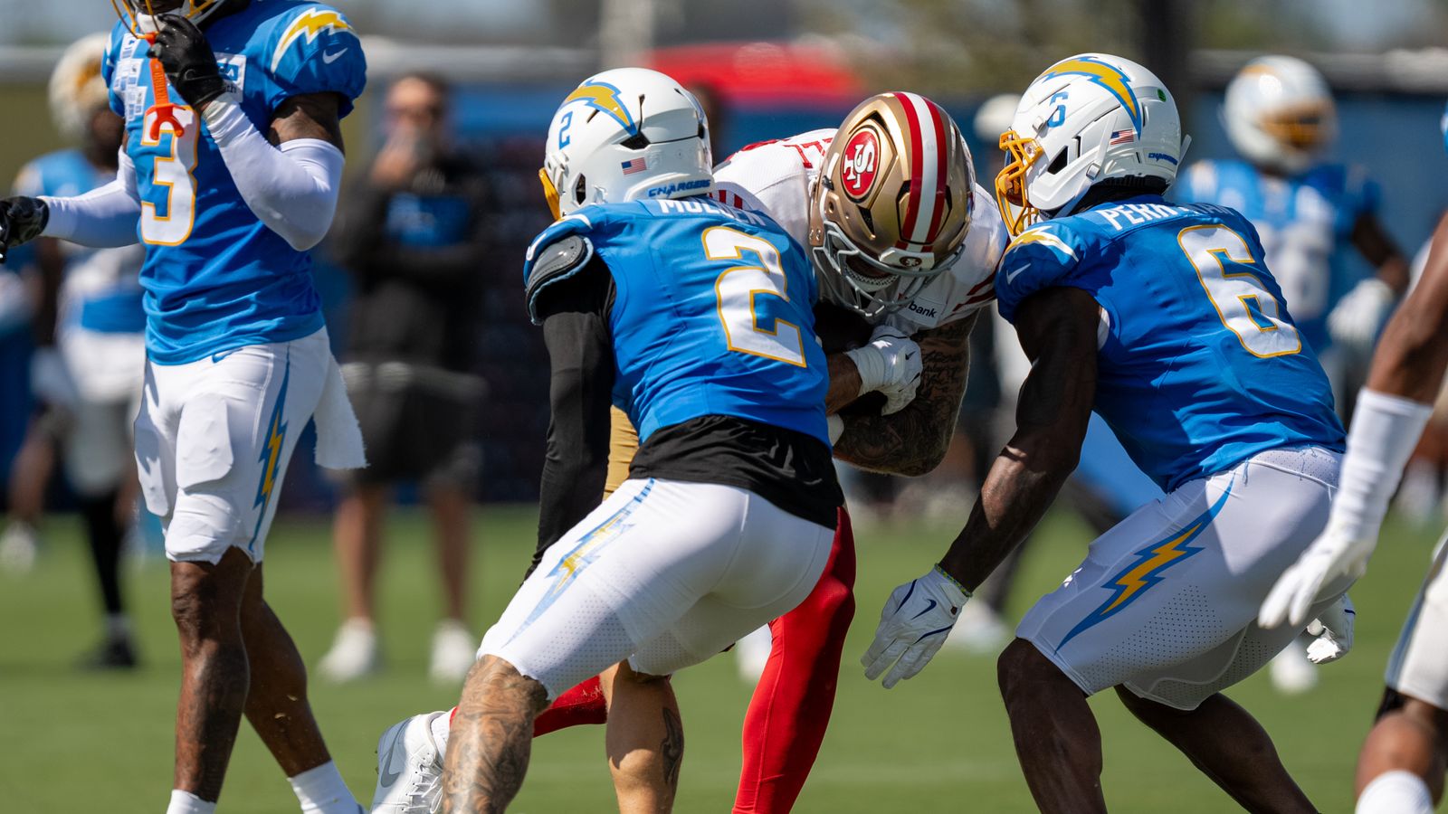 Los Angeles Chargers defensive back Elijah Molden (2) and linebacker Denzel Perryman (6) working together to tackle 49ers tight end Luke Farrell (89) during a joint Chargers and 49ers training camp at The Bolt on Saturday, August 18th in El Segundo, CA. Los Angeles Chargers defensive back Elijah Molden (2) and linebacker Denzel Perryman (6) working together to tackle 49ers tight end Luke Farrell (89) during a joint Chargers and 49ers training camp at The Bolt on Saturday, August 18th in El Segundo, CA.